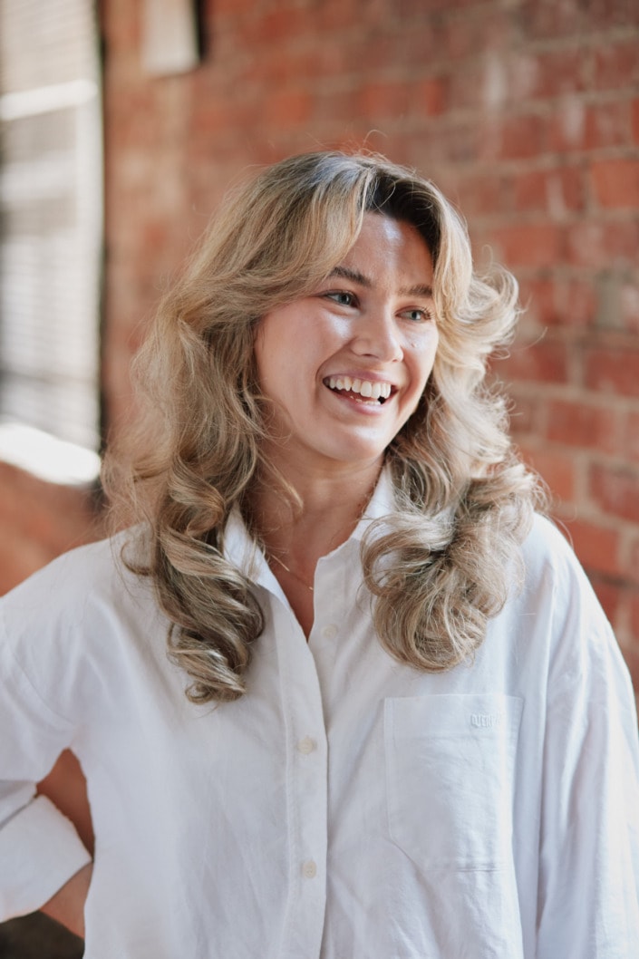 female environmental professional portrait taken in vancouver brick building