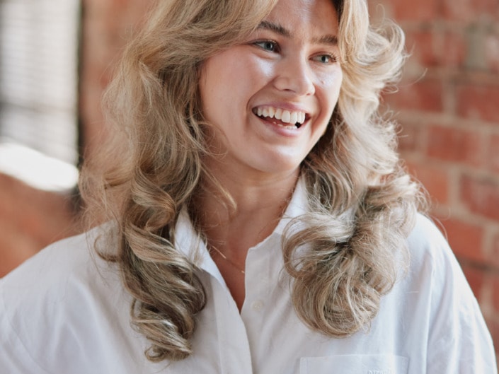 female environmental professional portrait taken in vancouver brick building