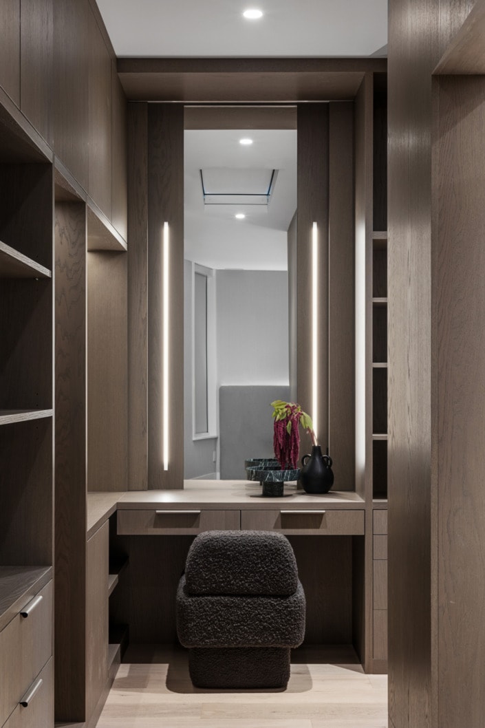 custom walk-in closet with hidden mirror